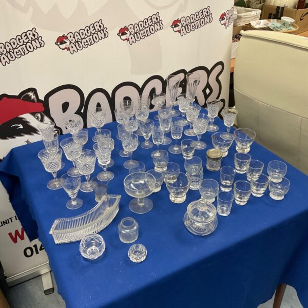 Assortment of vintage port and sherry glasses on display.