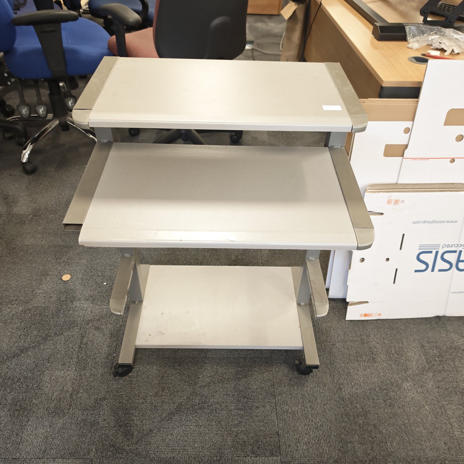 Portable PC desk with rolling casters and keyboard tray.