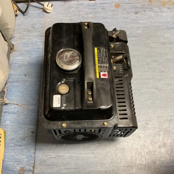 Compact portable petrol generator for outdoor use.