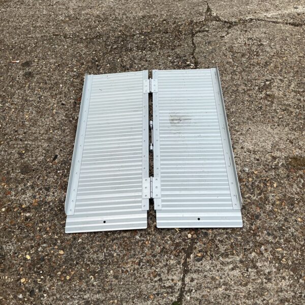 Portable folding wheelchair ramp for accessibility and mobility.