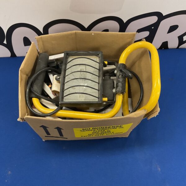 Vintage portable work light with metal cage.