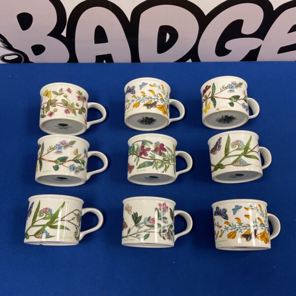 Set of nine Portmeirion Botanic Garden cups with floral designs.