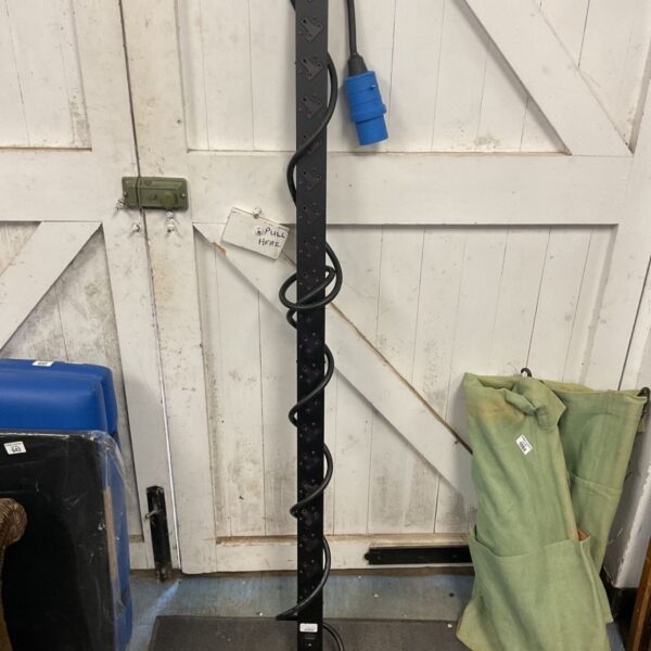 Black power distribution unit with multiple 13A sockets.