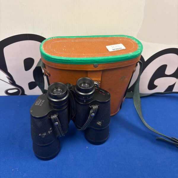 Vintage Prinz 10x50 binoculars in a worn case.