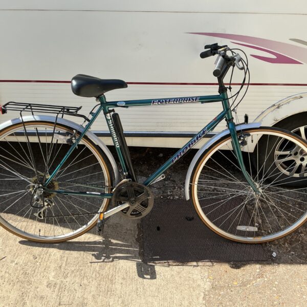 Dark green Probike Enterprise hybrid bicycle with mudguards and rack.