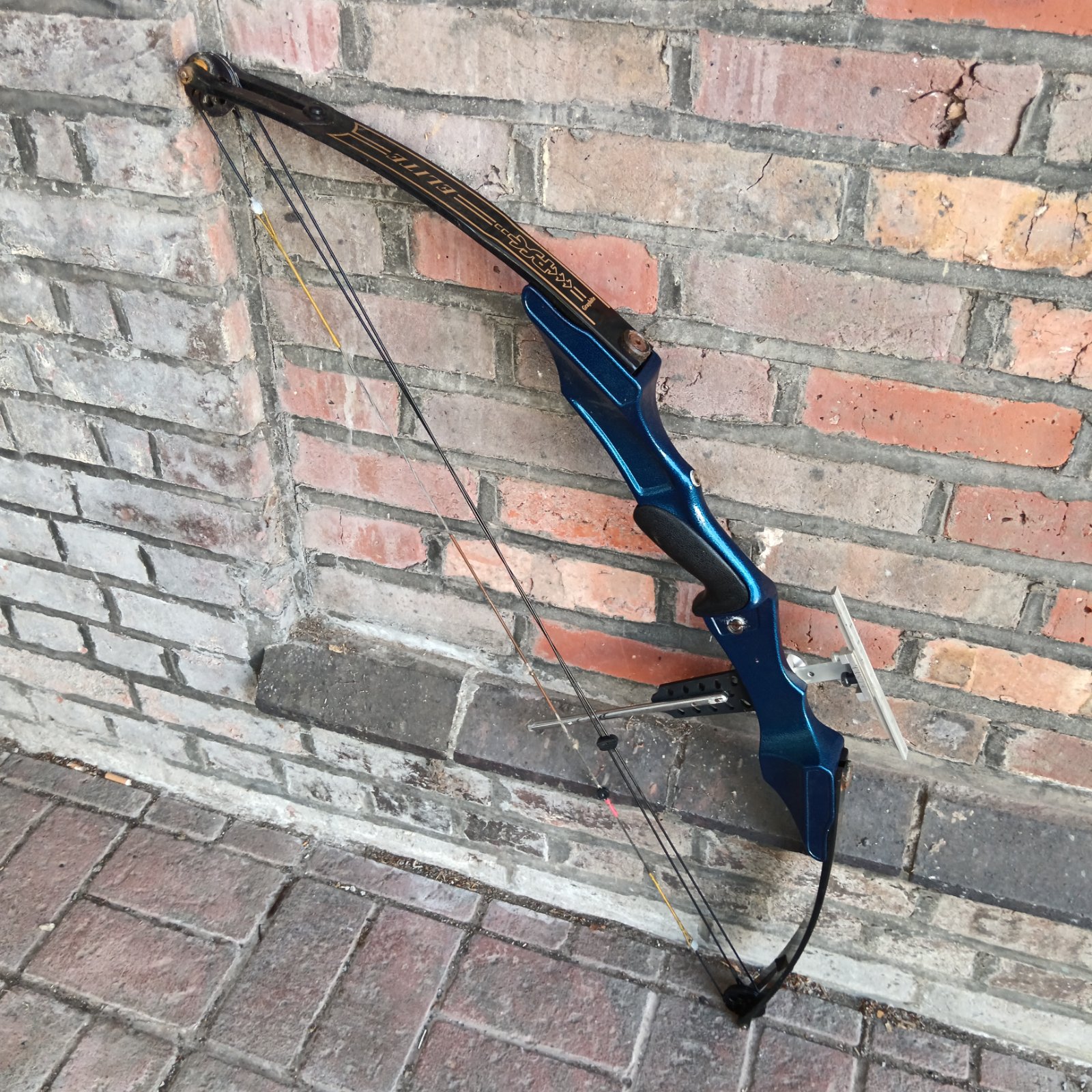 Blue PSE Elite Graphite compound bow for archery.
