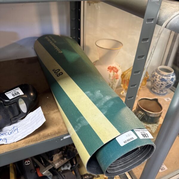 Green pub darts mat for game room floor protection.