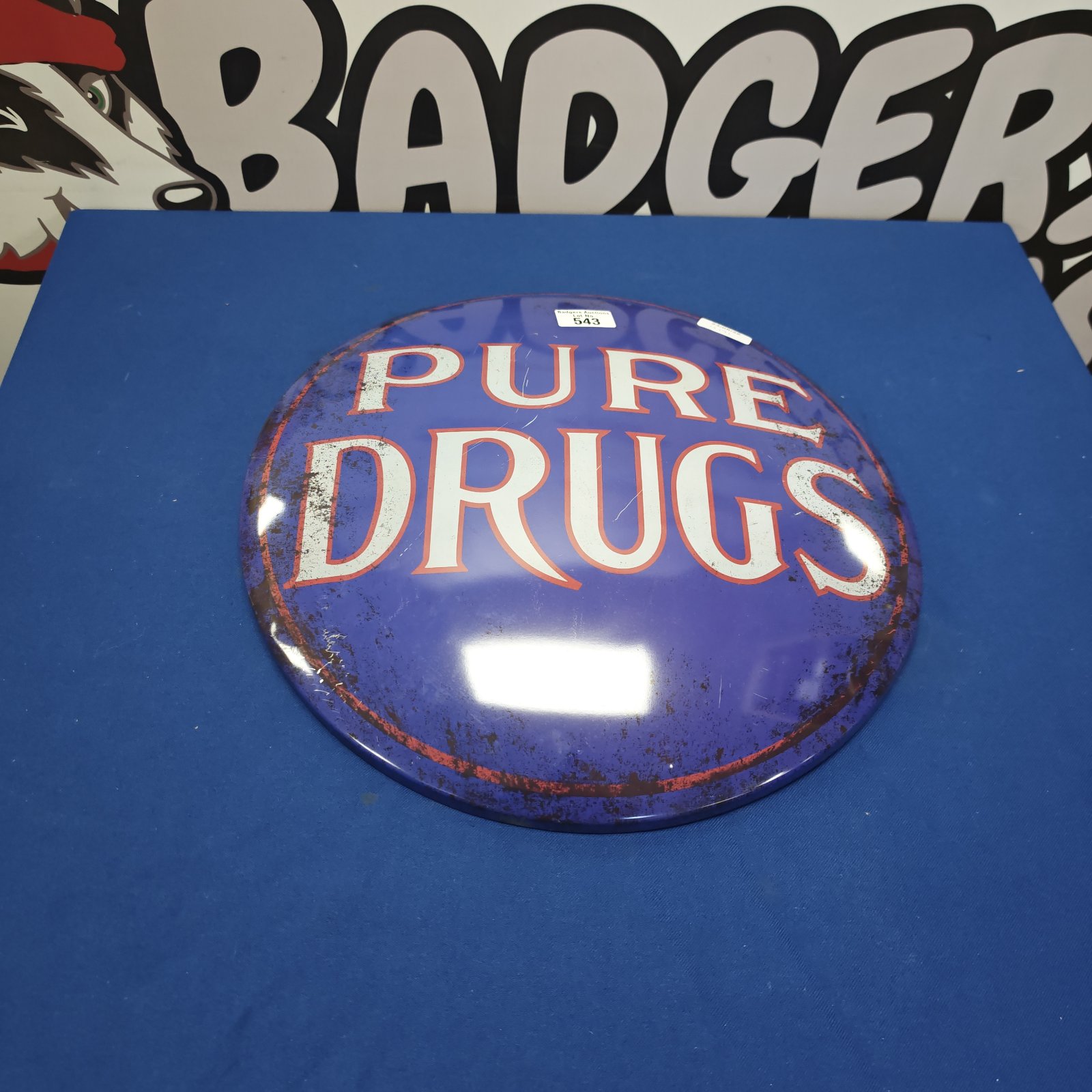 Reproduction metal sign with "Pure Drugs" text, vintage style wall decor.