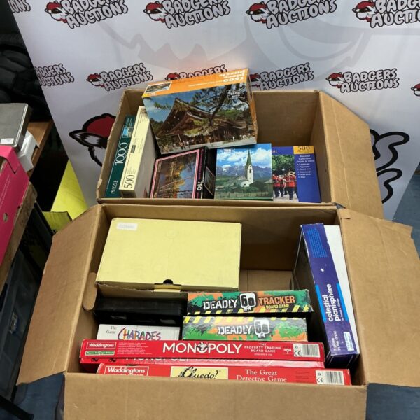 Assorted puzzles and games lot including jigsaw puzzles and board games.