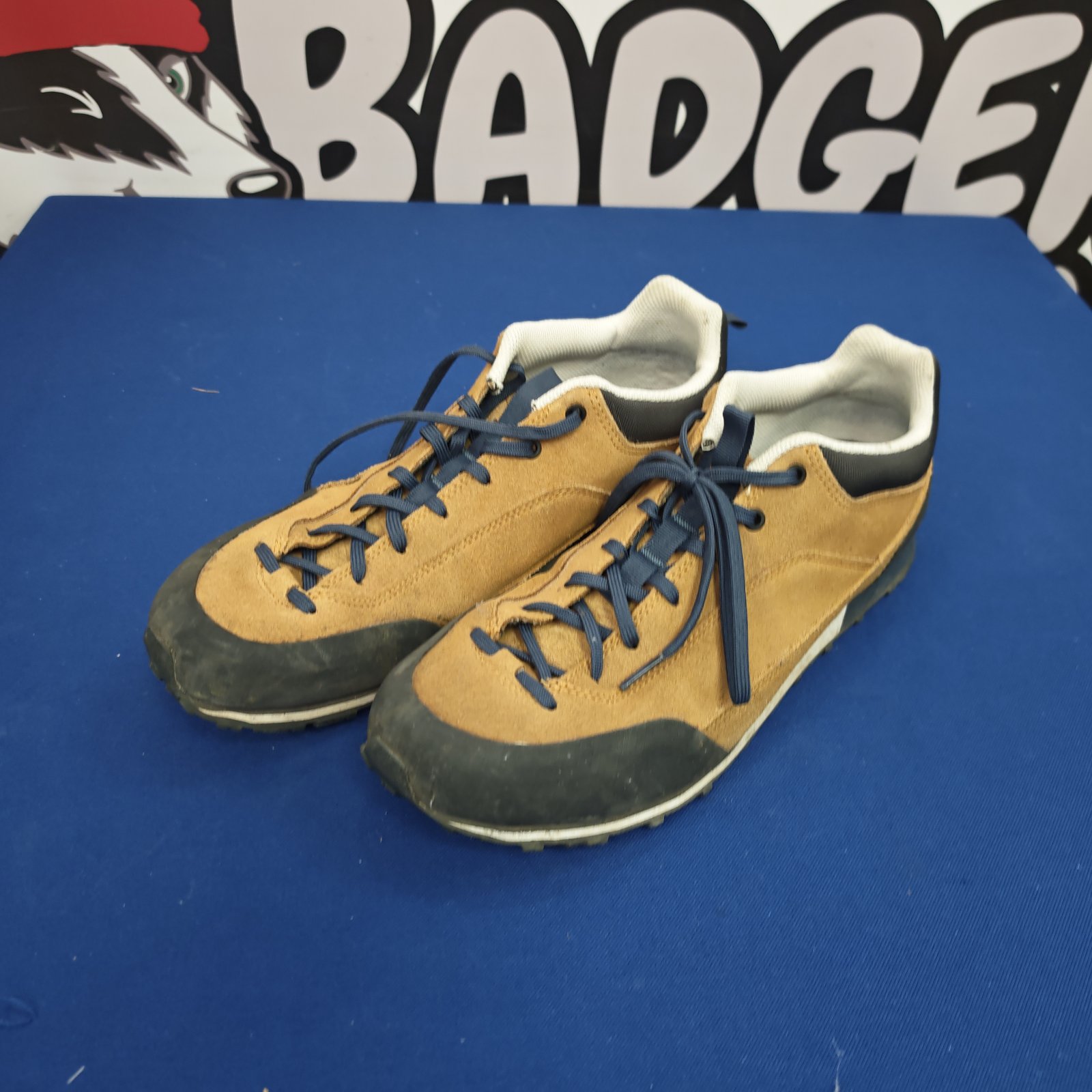Side view of used Quechua running shoes for trail running.