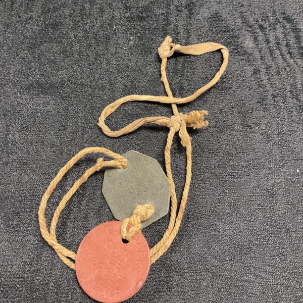 WWII RAF Volunteer Reserve dog tags showing embossed details.