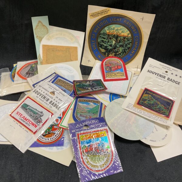 Vintage railway badges and stickers collection for collectors.