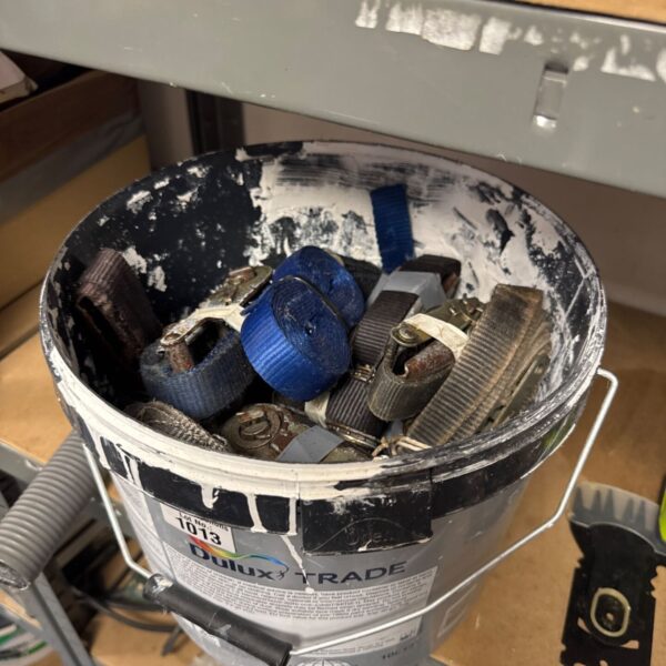 Used ratchet straps in a Dulux Trade bucket for securing loads.