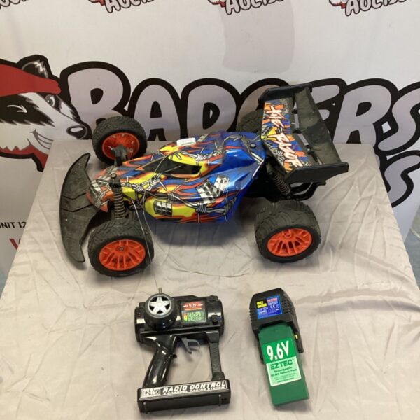 Vibrant red and blue RC car with remote control and charger.