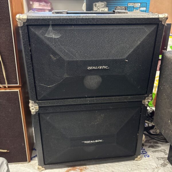 Vintage Realistic PA-25 speaker cabinet, showing wear and age.