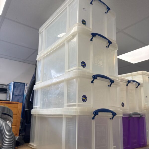 Clear plastic Really Useful storage boxes stacked for organisation.