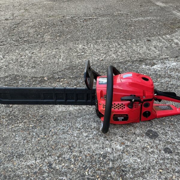 Red 58cc petrol chainsaw with guide bar cover.