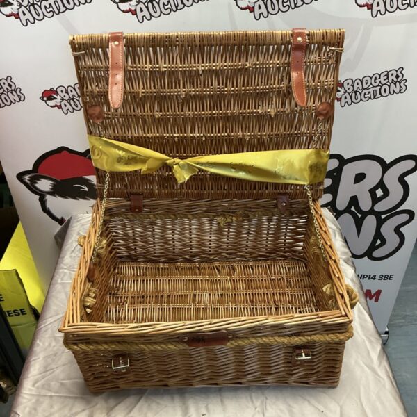 Vintage Regency hamper basket made of woven wicker.