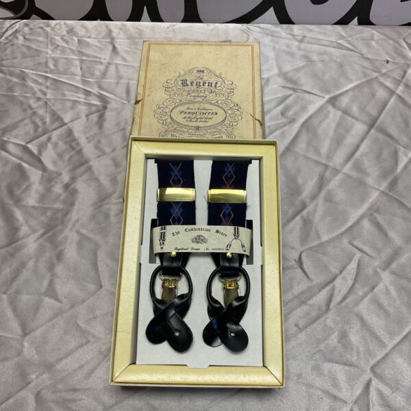 Vintage Regent trouser braces with patterned straps and leather clips.