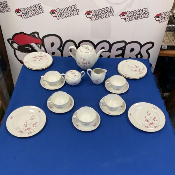 Vintage Rhenania Duisdorf porcelain tea set with floral design.