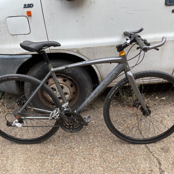 Silver Ridgeback Flight hybrid commuter bike in urban setting.