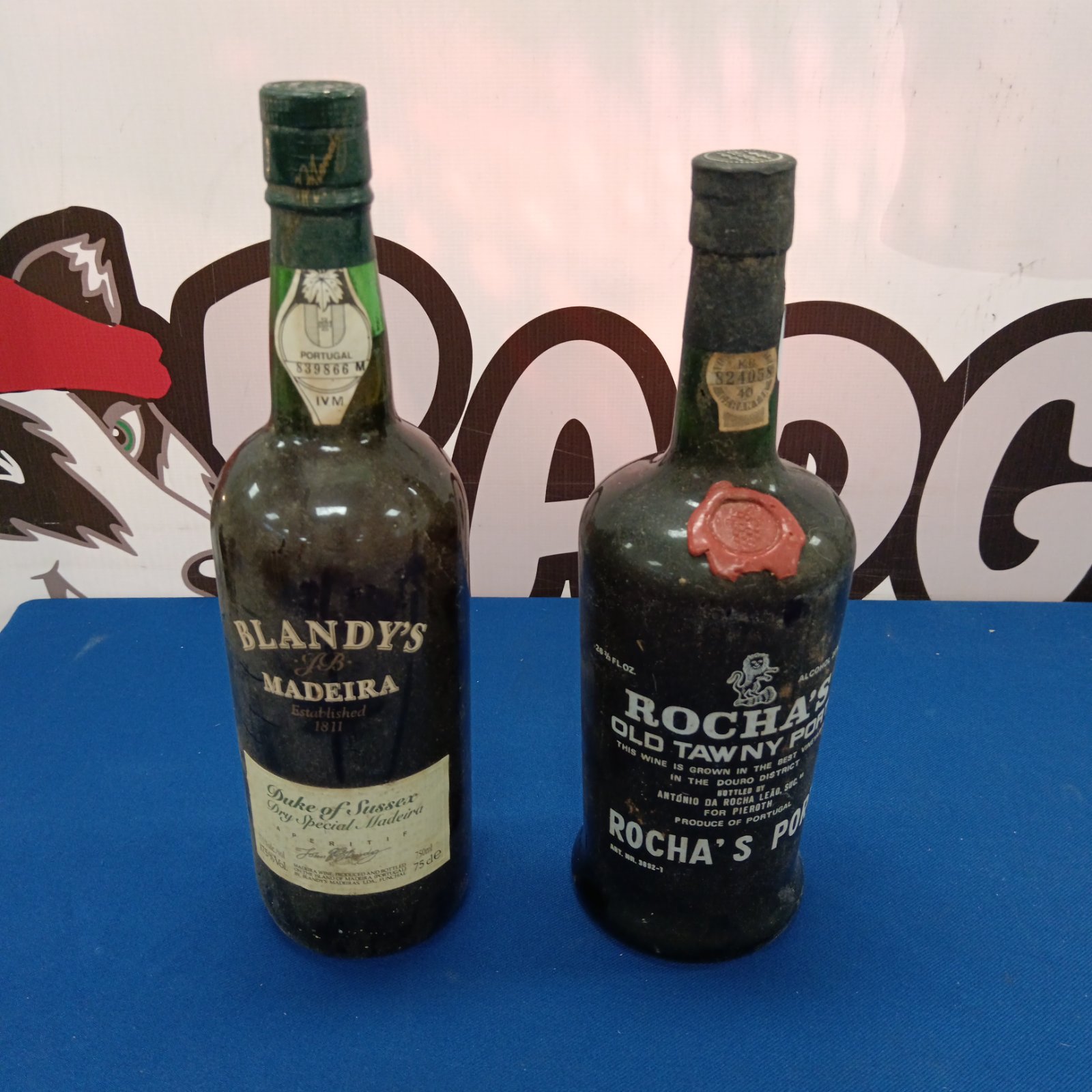 Vintage Rocha's Tawny Port and Blandys Madeira bottles, sealed and collectible.
