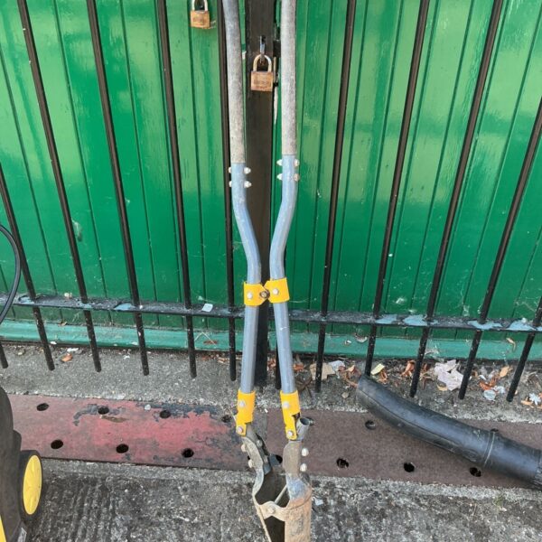 Roughneck post hole digger with steel blades and handle.