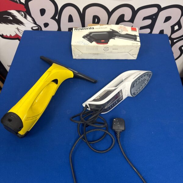 Rowenta DA56 steam brush with power cord, handheld garment care.
