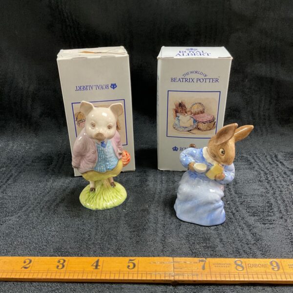 Royal Albert Beatrix Potter figurines, Pigling Bland and Cotton Tail, collectible porcelain.