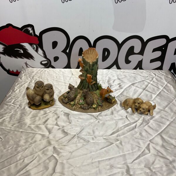 Royal Doulton animal figurines set including owls, cats and dogs.