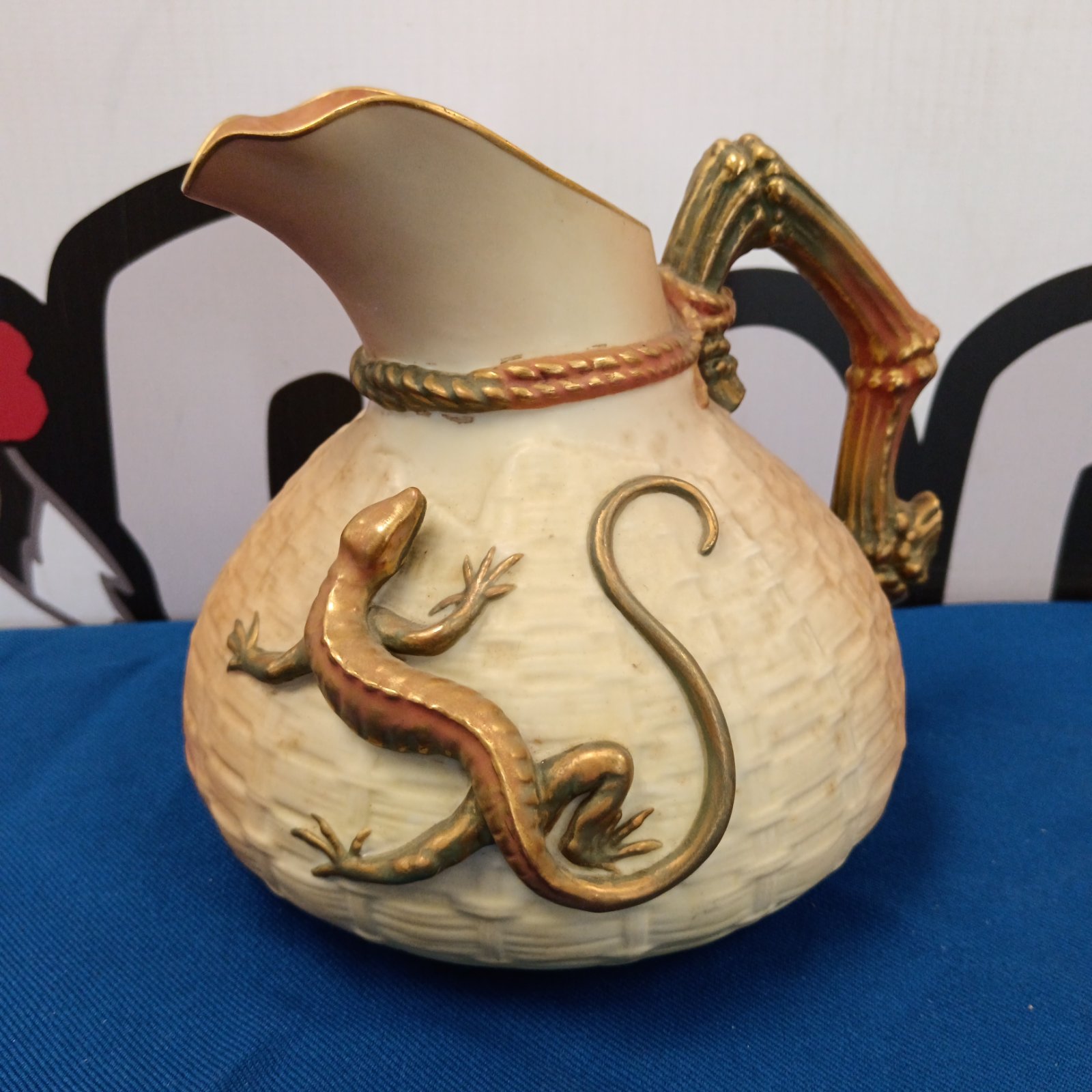 Antique Royal Doulton porcelain jug with lizard decoration.