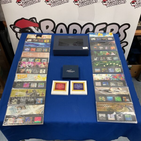Royal Mail Millennium stamp collection presentation packs in a box.