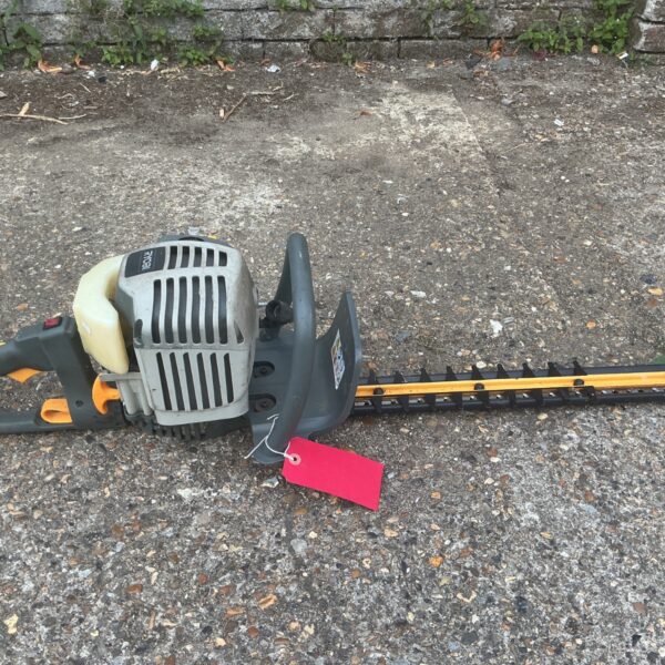 Used Ryobi petrol hedge trimmer for garden landscaping and hedge maintenance.