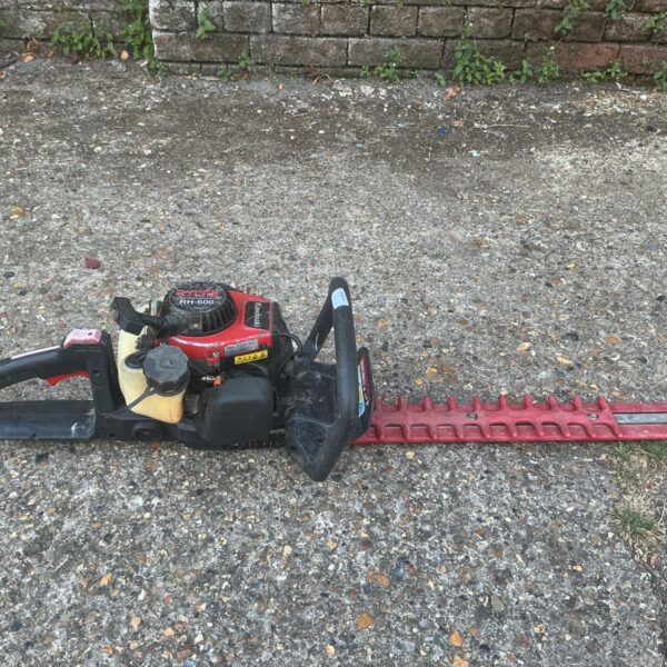 Used Ryobi RH-00 petrol hedge trimmer for garden landscaping.