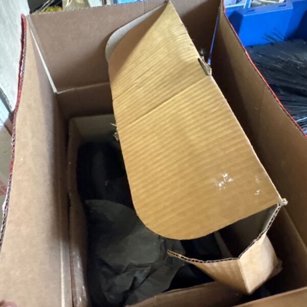 Unused safety boots and work gloves in original cardboard box.