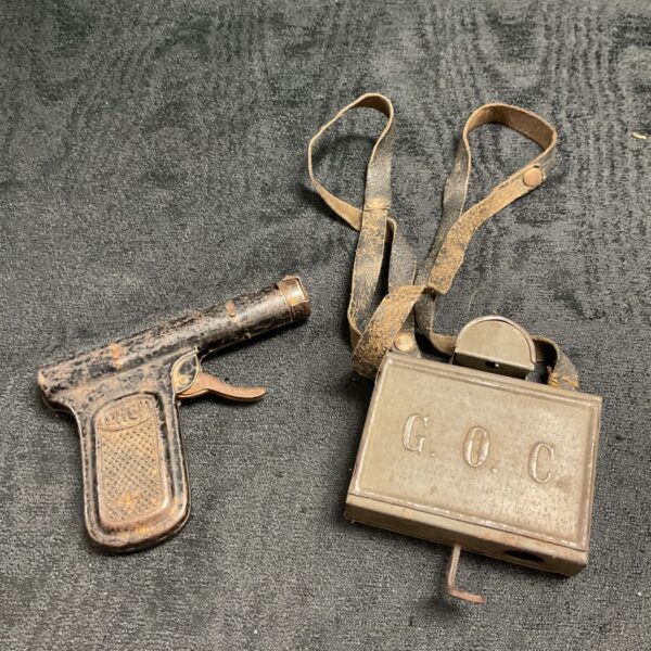 Vintage Salo water pistol and ticket punch, collectible metal toys.