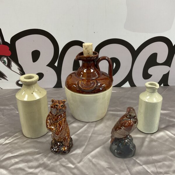 Vintage salt glazed stoneware jugs and Beswick whisky miniatures collection.