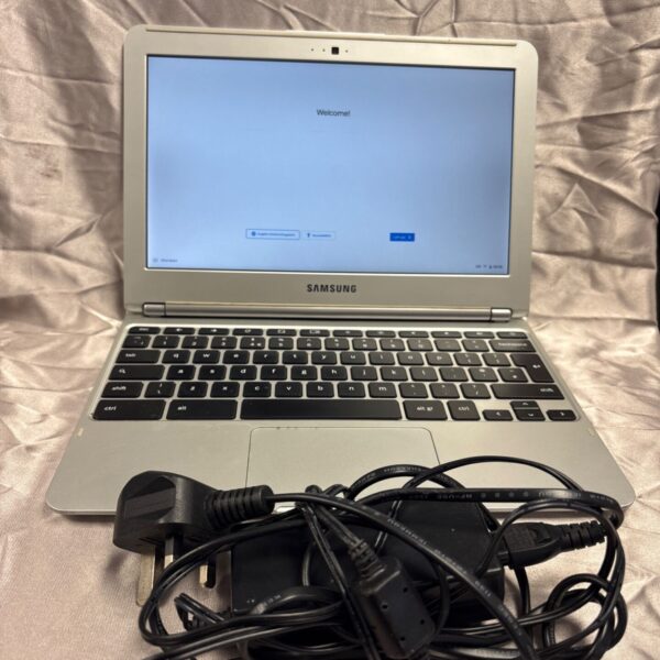 Samsung Chromebook XE303C12 laptop with charger, showing the screen.