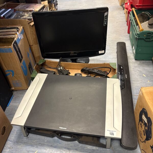Samsung TV and Sharp soundbar bundle with remotes.