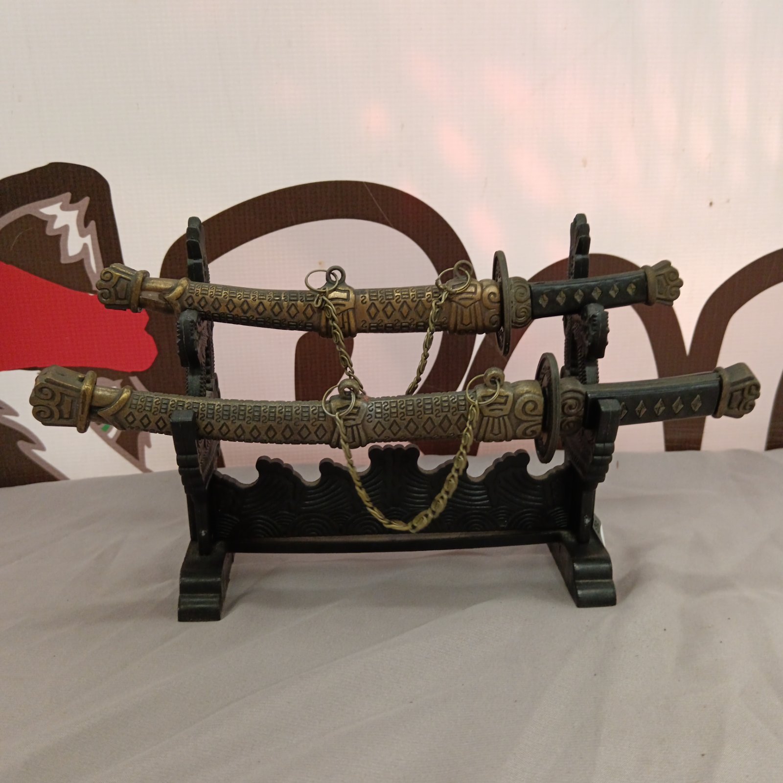 Detailed samurai letter opener set on display.