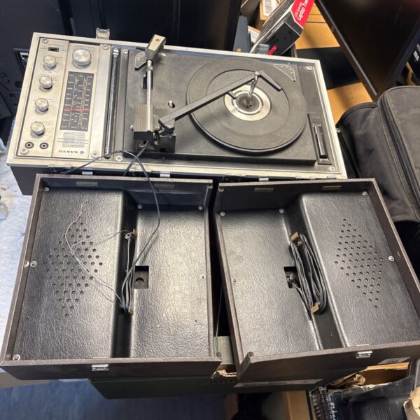 Vintage Sanyo portable record player with speakers, side view.