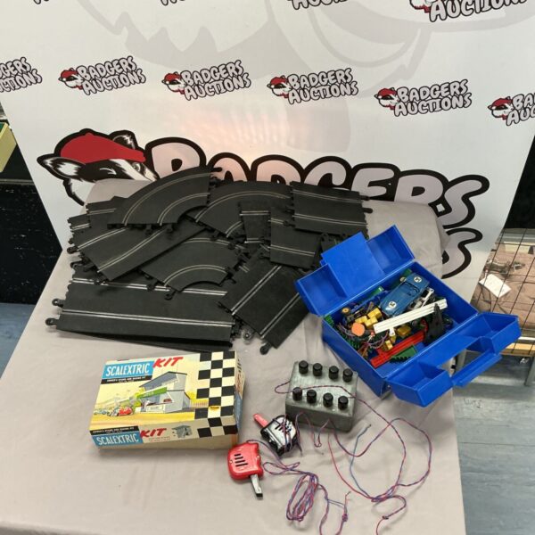 Vintage Triang Scalextric racing set with track and accessories.
