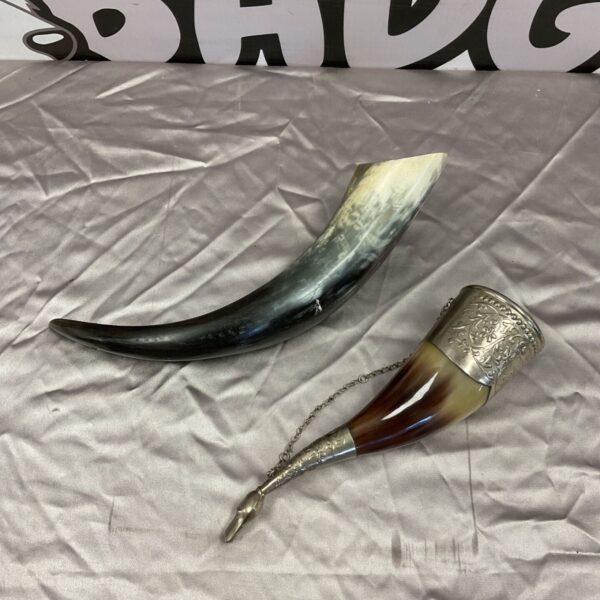 Pair of antique Scandinavian drinking horns with silvered mounts.