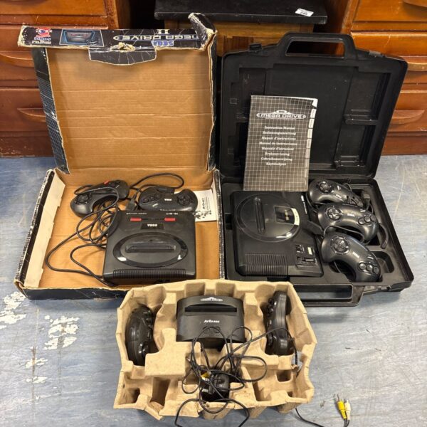 Sega Mega Drive console with controllers, a classic retro gaming system.