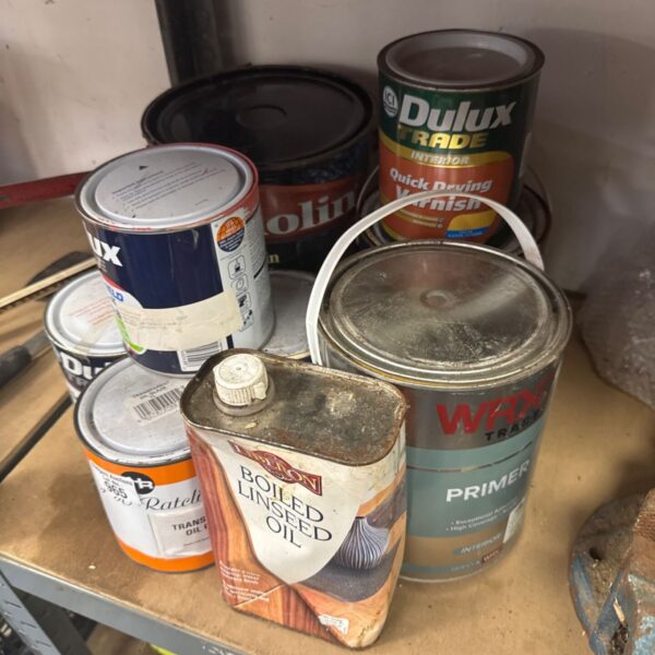 Mixed lot of shed clearance paints and chemicals for DIY projects.