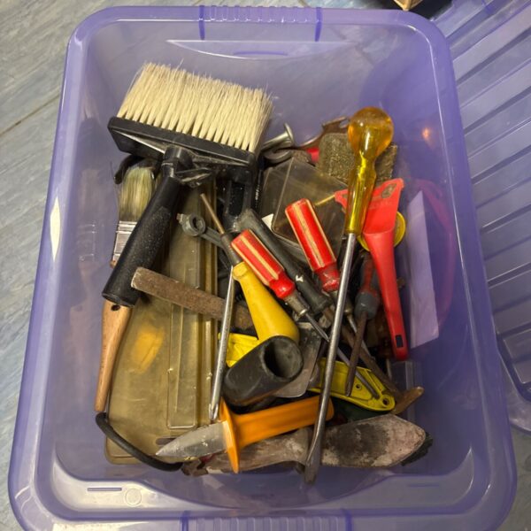 Mixed lot of shed clearance tools including screwdrivers and a saw.