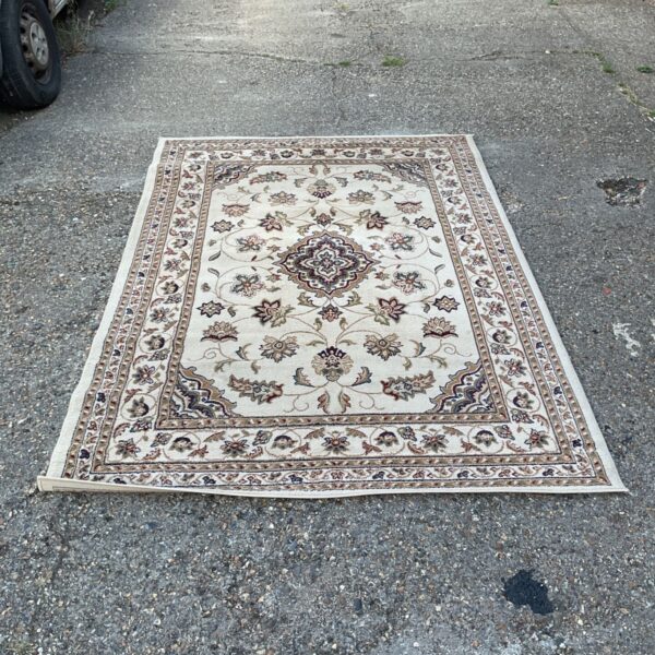 Beige Sherborne Sincerity rug with floral pattern.