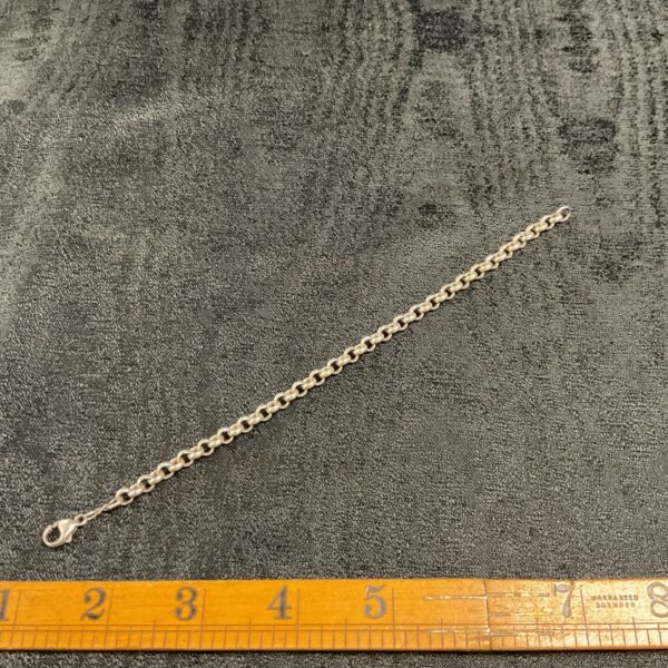 Close-up of a delicate 925 silver cable chain bracelet.