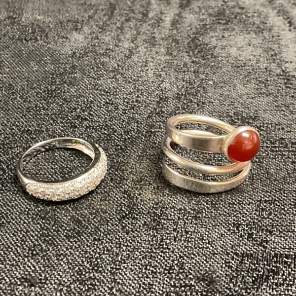 Silver ring set with CZ and amber stone, size N.