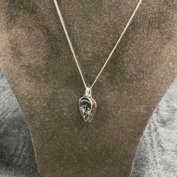 Close-up of a 925 silver friendship necklace with a pendant.